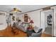 Cozy living room with hardwood floors, comfortable sofa, accent chair, and classic decor throughout at 401 N Main St, Louisburg, NC 27549