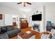 Bright and airy living room with hardwood floors, a fireplace, and comfortable seating, perfect for relaxation at 401 N Main St, Louisburg, NC 27549