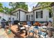 Relaxing patio with outdoor seating and a vibrant garden at 401 N Main St, Louisburg, NC 27549