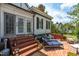 Charming patio with brick pavers, seating, and lush greenery at 401 N Main St, Louisburg, NC 27549