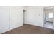 Bedroom with two doors and light brown carpet at 402 Poplar St, Graham, NC 27253