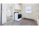 Spacious kitchen featuring white cabinets, an electric range, and view to another room at 402 Poplar St, Graham, NC 27253