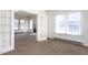 Bright living room with carpet and lots of windows for natural light at 402 Poplar St, Graham, NC 27253