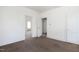 Bare living room offering a view into adjacent rooms, featuring outdated carpet, and painted walls at 402 Poplar St, Graham, NC 27253