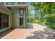 Spacious wooden deck offers serene views of the surrounding lush greenery at 4070 Swannie Coble Rd, Snow Camp, NC 27349