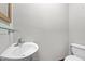 Bathroom featuring a sink, toilet, and minimal design elements at 4070 Swannie Coble Rd, Snow Camp, NC 27349