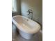 Close up of the bright, white, soaking bathtub at 4070 Swannie Coble Rd, Snow Camp, NC 27349