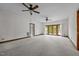 Spacious bedroom with neutral carpet, trim and double ceiling fans at 4070 Swannie Coble Rd, Snow Camp, NC 27349