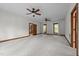 Open bedroom features neutral carpet, double windows and a ceiling fan at 4070 Swannie Coble Rd, Snow Camp, NC 27349