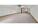 Bright bonus room featuring carpeted floors, ceiling fan, and natural light at 4070 Swannie Coble Rd, Snow Camp, NC 27349