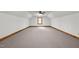 Large bonus room with carpeted floors, neutral walls, and natural light at 4070 Swannie Coble Rd, Snow Camp, NC 27349