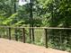 Wooden deck with cable railing and lake views at 4070 Swannie Coble Rd, Snow Camp, NC 27349