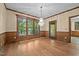 Dining room with wood floors, wood trim, and a crystal chandelier at 4070 Swannie Coble Rd, Snow Camp, NC 27349