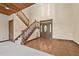 The foyer boasts hardwood floors, a wooden staircase, and stained-glass front door at 4070 Swannie Coble Rd, Snow Camp, NC 27349