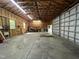 Spacious garage featuring a workbench and exposed framing at 4070 Swannie Coble Rd, Snow Camp, NC 27349