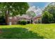 Spacious backyard showing the multi-tiered deck and lush landscaping at 4517 Gates St, Raleigh, NC 27609