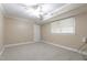 Basement bedroom with carpet, neutral paint and a window at 4517 Gates St, Raleigh, NC 27609