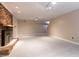 Large finished basement features brick fireplace and recessed lighting at 4517 Gates St, Raleigh, NC 27609