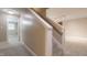 Carpeted basement stairs lead to a finished lower level with neutral paint at 4517 Gates St, Raleigh, NC 27609