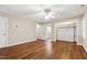 Bedroom with hardwood floors, ceiling fan and closet with shelving at 4517 Gates St, Raleigh, NC 27609