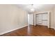 Bedroom with hardwood floors, chandelier and closet with bi-fold doors at 4517 Gates St, Raleigh, NC 27609