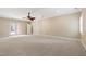 Large bedroom featuring neutral carpet, ceiling fan, and access to a patio at 4517 Gates St, Raleigh, NC 27609