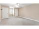 Spacious bedroom with neutral walls, white trim, and plush carpet at 4517 Gates St, Raleigh, NC 27609