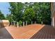 Spacious deck with black metal railings surrounded by a lush, green treeline at 4517 Gates St, Raleigh, NC 27609