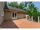 Wide-angle view of deck, outdoor kitchen, and wooded backyard at 4517 Gates St, Raleigh, NC 27609