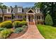 Attractive brick home with manicured landscaping and a patterned walkway at 4517 Gates St, Raleigh, NC 27609
