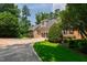 Charming home exterior featuring a circular driveway and basketball court at 4517 Gates St, Raleigh, NC 27609