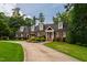 Charming traditional home featuring dormer windows and a well-manicured front lawn with mature landscaping at 4517 Gates St, Raleigh, NC 27609