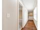 Bright hallway featuring hardwood floors and natural light from a window at 4517 Gates St, Raleigh, NC 27609