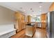 Well-lit kitchen boasting custom cabinetry, stainless steel appliances, and a large island at 4517 Gates St, Raleigh, NC 27609