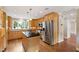 Kitchen with stainless appliances, island, and natural light at 4517 Gates St, Raleigh, NC 27609