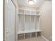 Mudroom with built-in storage and tiled flooring at 4517 Gates St, Raleigh, NC 27609
