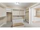 Large walk-in closet with custom shelving and a center island with seating at 4517 Gates St, Raleigh, NC 27609