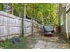 Backyard with a wooden fence and covered equipment at 5105 Baywood Forest Dr, Knightdale, NC 27545