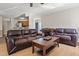 Cozy living room features hardwood floors, comfortable sofas, and a view into the kitchen at 5105 Baywood Forest Dr, Knightdale, NC 27545