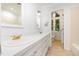 Classic bathroom featuring dual sinks, tiled floors and a large vanity at 5217 West Oaks Dr, Fuquay Varina, NC 27526