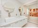 Well-lit bathroom featuring dual vessel sinks, a marble countertop and walk-in shower at 5217 West Oaks Dr, Fuquay Varina, NC 27526