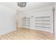 Spacious bedroom featuring light floors and built-in shelving at 5217 West Oaks Dr, Fuquay Varina, NC 27526