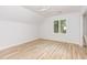 Cozy bedroom featuring a window, ceiling fan and light flooring at 5217 West Oaks Dr, Fuquay Varina, NC 27526