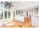 Open concept living space with vaulted ceilings, large windows and gleaming hardwood floors at 5217 West Oaks Dr, Fuquay Varina, NC 27526