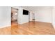 Bright living room with hardwood floors, detailed wall molding, and an open floor plan at 5217 West Oaks Dr, Fuquay Varina, NC 27526
