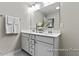 Bathroom featuring dual sinks, modern fixtures and vanity with ample countertop space at 67 Little Leaf Ln # 98, Clayton, NC 27527