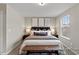 Well-lit bedroom with a large bed and two windows providing neighborhood views at 67 Little Leaf Ln # 98, Clayton, NC 27527