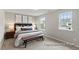 Inviting bedroom with natural light, plush carpeting, and stylish decor at 67 Little Leaf Ln # 98, Clayton, NC 27527