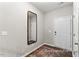 A decorative mirror brightens the home's entryway with a welcome feel at 67 Little Leaf Ln # 98, Clayton, NC 27527