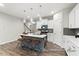 Modern kitchen featuring an island with seating and pendant lighting at 67 Little Leaf Ln # 98, Clayton, NC 27527